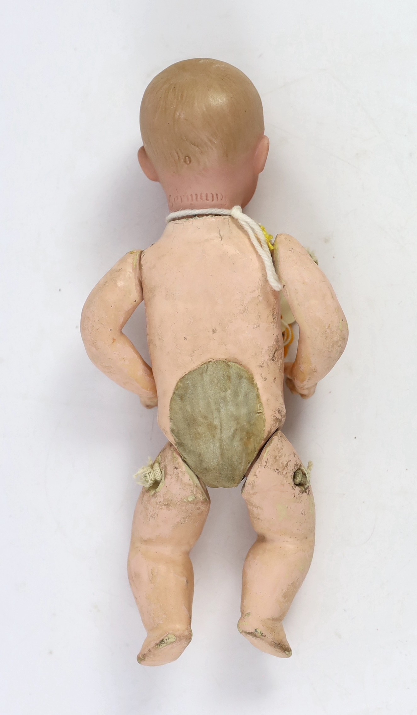 A Gebrüder Heubach bisque character boy doll, German, circa 1912, 9in.